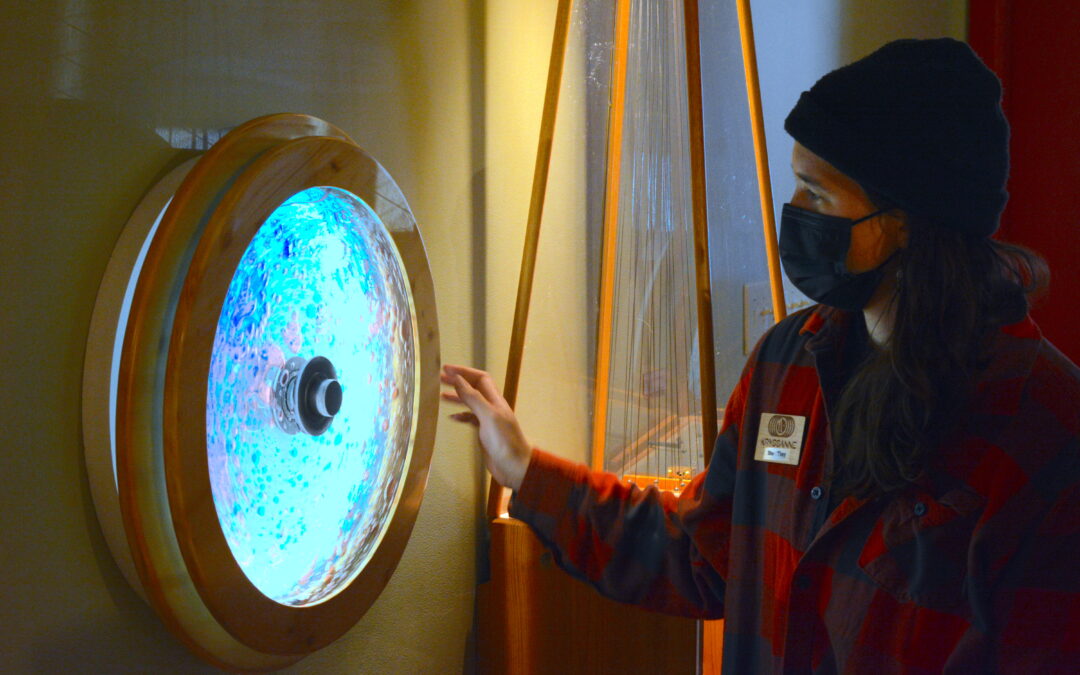 Krysanne Adams demonstrates Colored Waterwheel Exhibit